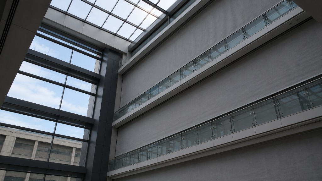 Fire-rated curtains deployed at each floor of a multistory atrium, closing the open volume without mechanical exhaust.